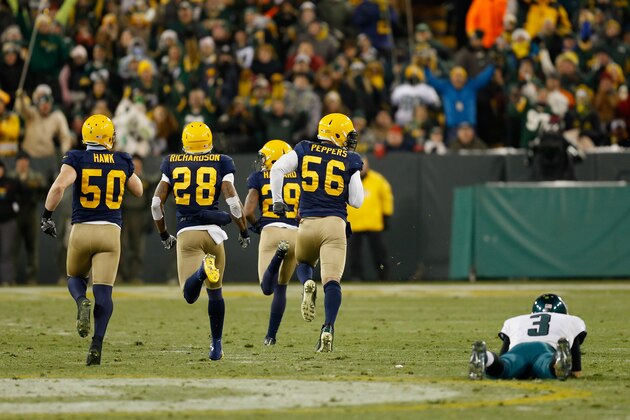 GREEN BAY, WI - NOVEMBER 16:   Casey Hayward #29 of the Green Bay Packers runs a fumble by quarterback  Mark Sanchez #3 of the Philadelphia Eagles for a touchdown during the fourth quarter of the game at Lambeau Field on November 16, 2014 in Green Bay, Wisconsin.  (Photo by Mike Zarrilli/Getty Images)