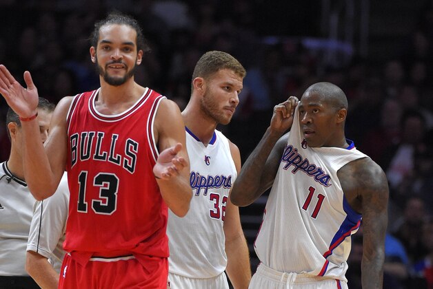 Chicago Bulls center Joakim Noah, left, claps after Los Angeles Clippers guard Jamal Crawford, right, was called for a technical foul as forward Blake Griffin looks on during the second half of an NBA basketball game, Monday, Nov. 17, 2014, in Los Angeles.   The Bulls won 105-89. (AP Photo/Mark J. Terrill)