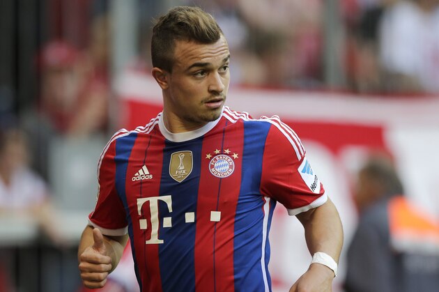 Bayern's Xherdan Shaqiri of Switzerland watches his team mates during the German first division Bundesliga soccer match between FC Bayern and SV Werder Bremen in the Allianz Arena in Munich, Germany, on Saturday, Oct. 18, 2014. (AP Photo/Matthias Schrader)