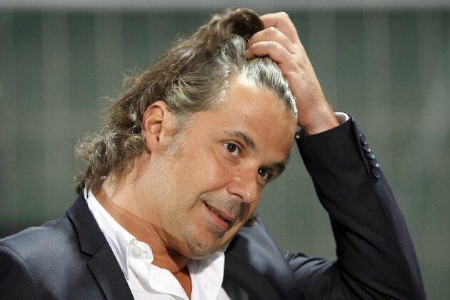 FILE - In this Sept.24, 2013 file photo, Marseille soccer club President Vincent Labrune, reacts during aFrench League One match against Saint Etienne, in Marseille, southern France. Police say Tuesday, Nov. 18, 2014 that Labrune is in custody as part of an investigation into the transfer of striker Andre-Pierre Gignac to the French league club in 2010. (AP Photo/Claude Paris)