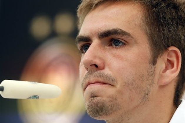 Germany’s Philipp Lahm pauses during a press conference of Germany prior to the Euro 2012 soccer semifinal match slated for June 28,  in Gdansk, Poland, Sunday, June 24, 2012. (AP Photo/Frank Augstein)