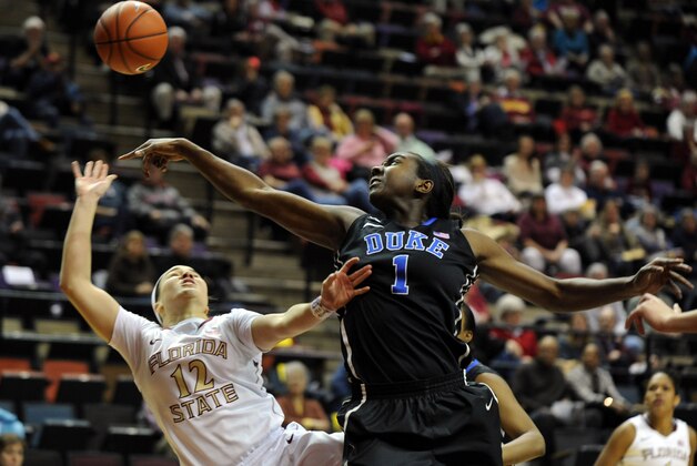 Jan 23, 2014; Tallahassee, FL, USA; Duke Blue Devils center Elizabeth Williams (1) blocks a shot from Florida State Seminoles guard Brittany Brown (12) during the first half of the game at the Donald L. Tucker Center (Tallahassee). Mandatory Credit: Melina Vastola-USA TODAY Sports