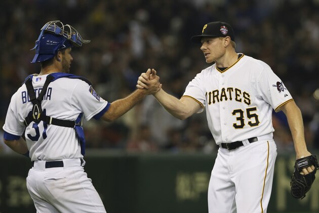 MLB All-Stars closer Mark Melancon (35) celebrates with catcher Drew Butera after beating Japan 6-1 in Game 4 of their exhibition baseball series at Tokyo Dome in Tokyo, Sunday, Nov. 16, 2014.(AP Photo/Koji Sasahara)