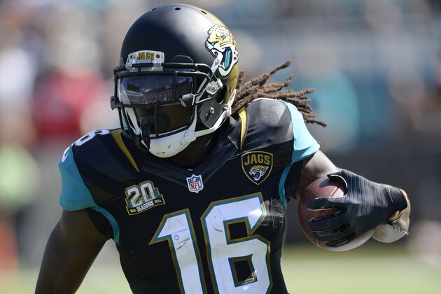Oct 26, 2014; Jacksonville, FL, USA; Jacksonville Jaguars running back Denard Robinson (16) carries the ball against the Miami Dolphins in the first quarter at EverBank Field. Mandatory Credit: Richard Dole-USA TODAY Sports
