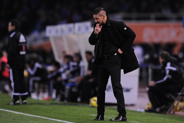 Atletico de Madrid's head coach Diego Simeone of Argentina, laments after the second goal scored by Real Sociedad during their La Liga soccer match, at Anoeta stadium in San Sebastian, northern Spain, Sunday Nov. 9, 2014. Atletico de Madrid lost  2-1. (AP Photo/Alvaro Barrientos)
