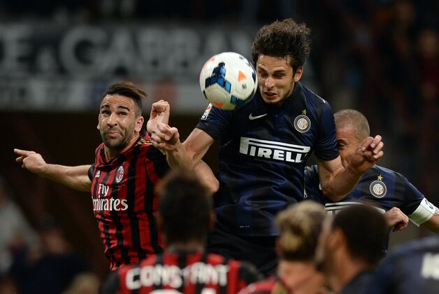 MILAN, ITALY - MAY 04:  Andrea Ranocchia of FC Inter Milan and Adil Rami of AC Milan (L) compete for the ball during the Serie A match between AC Milan and FC Internazionale Milano at Stadio Giuseppe Meazza on May 4, 2014 in Milan, Italy.  (Photo by Claudio Villa/Getty Images)