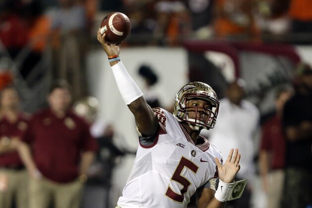 Florida State quarterback Jameis Winston (5) passes during the second half of an NCAA college football game against the Miami Hurricanes, Saturday, Nov. 15, 2014, in Miami Gardens, Fla. (AP Photo/Wilfredo Lee)