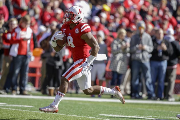 Nebraska running back Ameer Abdullah (8) carries the ball during warmups before an NCAA college football game against Purdue in Lincoln, Neb., Saturday, Nov. 1, 2014. (AP Photo/Nati Harnik)