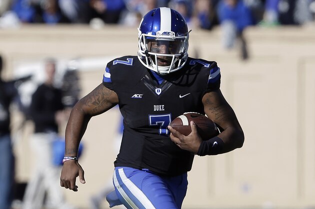Duke quarterback Anthony Boone (7) runs against  Virginia Tech during the second half of an NCAA college football game in Durham, N.C., Saturday, Nov. 15, 2014. Virginia Tech won 17-16. (AP Photo/Gerry Broome)