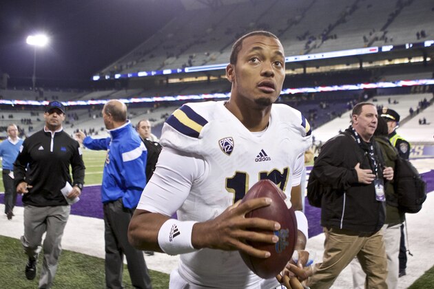 UCLA quarterback Brett Hundley runs off the field after an NCAA college football game against Washington, Saturday, Nov. 8, 2014, in Seattle. UCLA won the game 44-30. (AP Photo/Stephen Brashear)