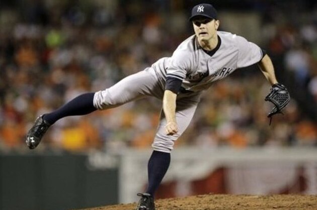 New York Yankees relief pitcher David Robertson follows through on a pitch to the Baltimore Orioles in the ninth inning of a baseball game, Sunday, Sept. 14, 2014, in Baltimore. (AP Photo/Patrick Semansky)