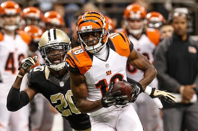 Nov 16, 2014; New Orleans, LA, USA; Cincinnati Bengals wide receiver A.J. Green (18) is pursued by New Orleans Saints defensive back A.J. Davis (20) during the second half of a game at the Mercedes-Benz Superdome. The Bengals defeated the Saints 27-10. Mandatory Credit: Derick E. Hingle-USA TODAY Sports