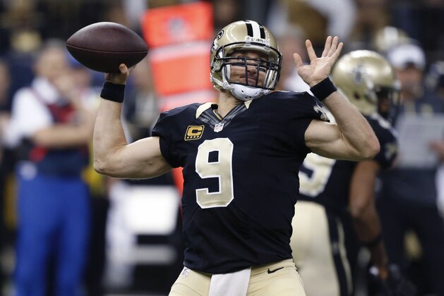 New Orleans Saints quarterback Drew Brees (9) passes in the second half of an NFL football game against the Cincinnati Bengals in New Orleans, Sunday, Nov. 16, 2014. (AP Photo/Rogelio Solis)