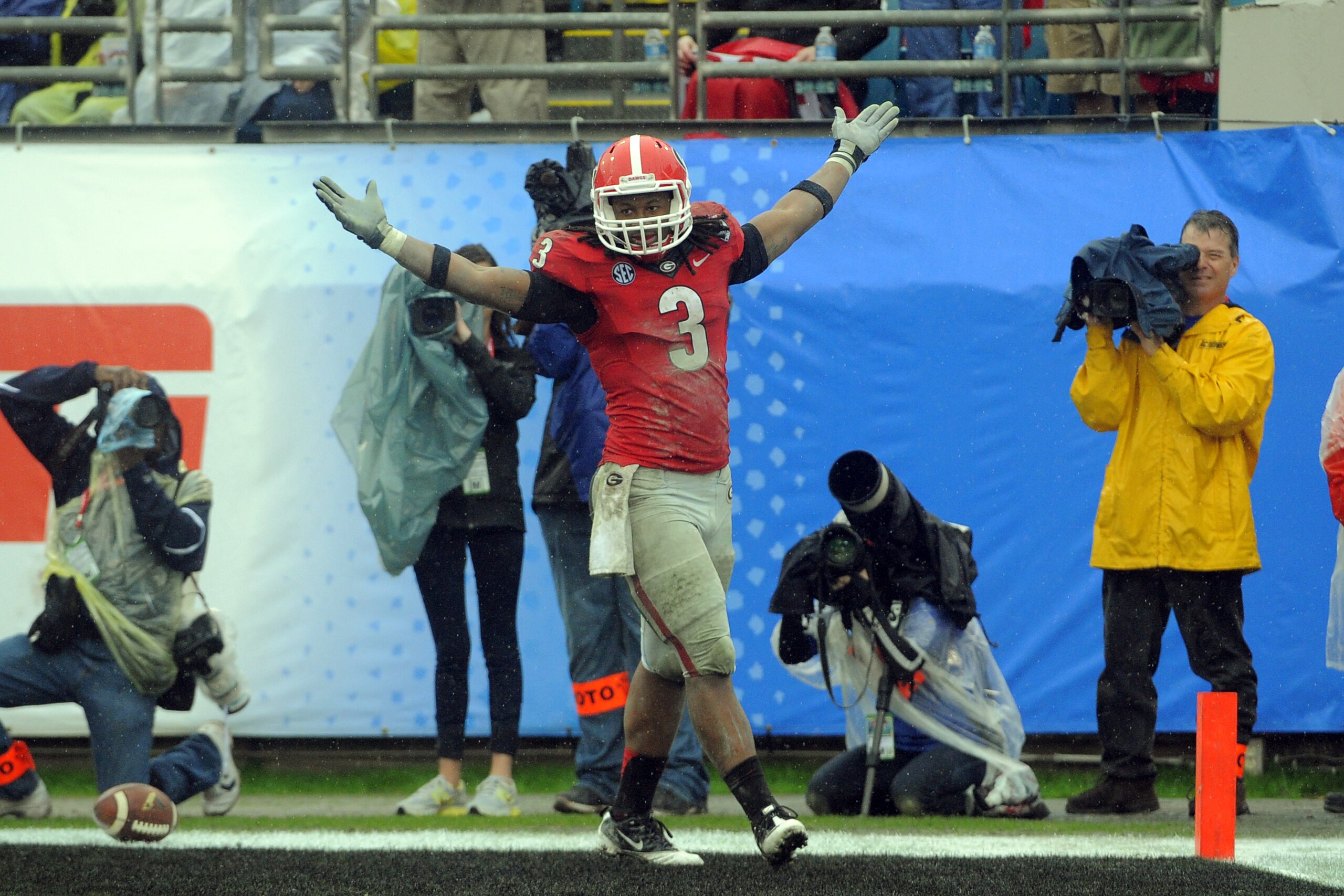 Georgia running back Todd Gurley (3) celebrates a touch down during the second half of the Gator Bowl NCAA college football game against Nebraska, Wednesday, Jan. 1, 2014, in Jacksonville, Fla. Nebraska beat Georgia 24-19. (AP Photo/Stephen B. Morton)