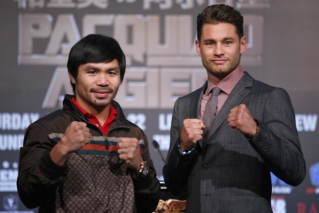 WBO Welterweight champion Manny Pacquiao, left, of the Philippines, and WBO junior welterweight champion Chris Algieri of United States, right, pose for photographers during a news conference in Macau, Monday, Aug. 25, 2014. The boxers are scheduled to battle in WBO welterweight title match at The Venetian Macao on Nov. 23 in Macau. (AP Photo/Vincent Yu)