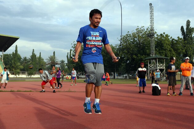 GENERAL SANTOS, PHILIPPINES - OCTOBER 02:  Manny Pacquiao trains at Pedro Antonio Acharon Sports Complex on October 2, 2014 in General Santos, Philippines.  (Photo by Jeoffrey Maitem/Getty Images)
