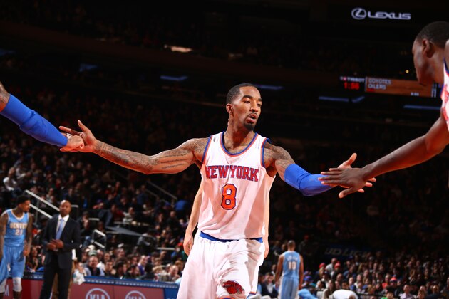 NEW YORK, NY - NOVEMBER 16: J.R. Smith #8 of the New York Knicks shakes hands with his teammates during the game against the Denver Nuggets at Madison Square Garden in New York City, New York on November 16, 2014.  NOTE TO USER: User expressly acknowledges and agrees that, by downloading and or using this photograph, User is consenting to the terms and conditions of the Getty Images License Agreement. Mandatory Copyright Notice: Copyright 2014 NBAE  (Photo by Nathaniel S. Butler/NBAE via Getty Images)