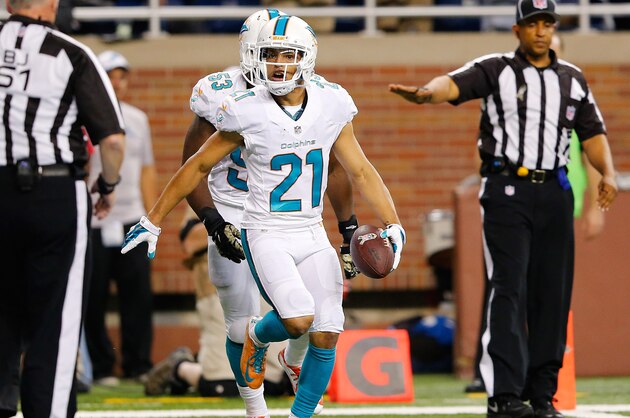 DETROIT, MI - NOVEMBER 09: Brent Grimes #21 of the Miami Dolphins celebrates a second quarter interception against the Detroit Lions at Ford Field on November 09 , 2014 in Detroit, Michigan. (Photo by Leon Halip/Getty Images)