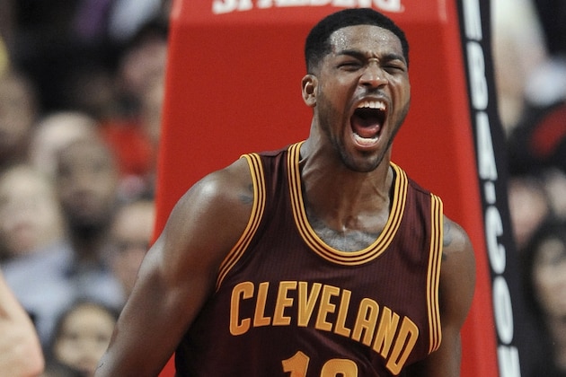 Cleveland Cavaliers' Tristan Thompson celebrates after dunking during the final seconds of overtime in an NBA basketball game against the Chicago Bulls in Chicago, Friday, Oct. 31, 2014. Cleveland won 114-108. (AP Photo/Paul Beaty)
