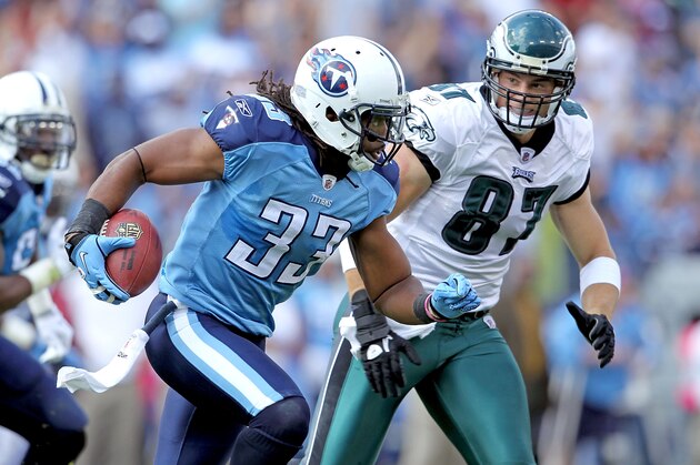 NASHVILLE, TN - OCTOBER 24: Michael Griffin #33 of the Tennessee Titans runs with the ball after intercepting a pass while defended by Brent Celek #87 of the Philadelphia Eagles at LP Field on October 24, 2010 in Nashville, Tennessee. The Titans won 37-19.  (Photo by Andy Lyons/Getty Images)
