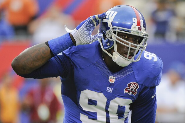 New York Giants defensive end Jason Pierre-Paul (90) reacts after a defensive play against the Houston Texans in the second quarter of an NFL football game, Sunday, Sept. 21, 2014, in East Rutherford, N.J. (AP Photo/Bill Kostroun)