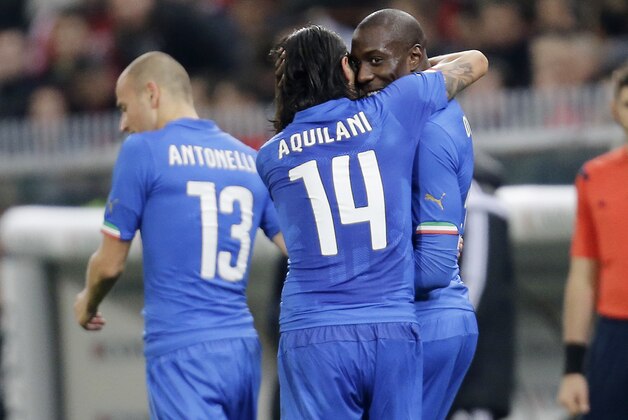 Italy’s Stefano Okaka, right, celebrates with his teammate Alberto Aquilani after scoring during the friendly soccer match between Italy and Albania, at the Luigi Ferraris stadium in Genoa, Italy, Tuesday, Nov. 18, 2014. (AP Photo/Antonio Calanni)