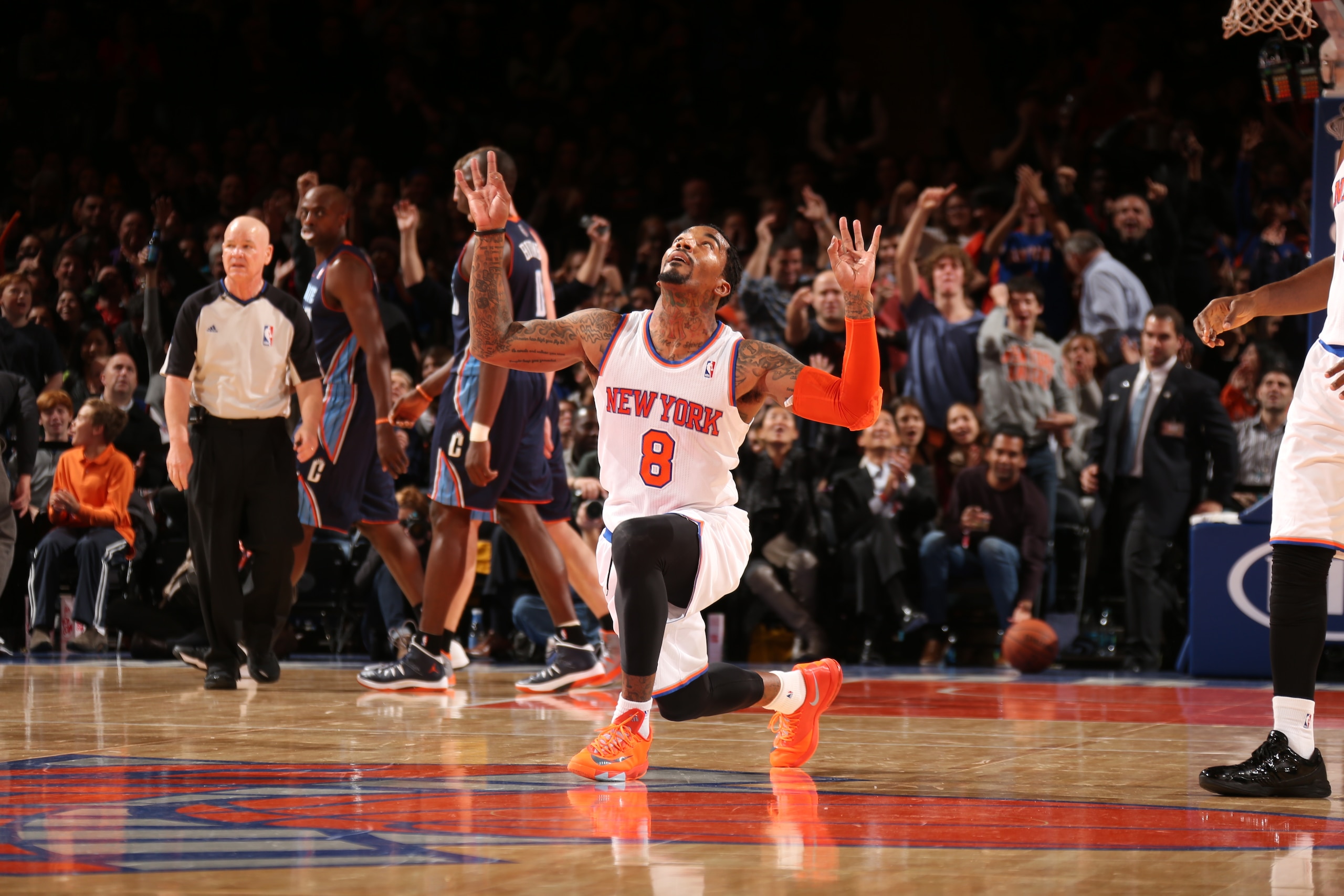 NEW YORK, NY - OCTOBER 25: J.R. Smith #8 of the New York Knicks celebrates during a preseason game against the Charlotte Bobcats on October 25, 2013 at Madison Square Garden in New York City.  NOTE TO USER: User expressly acknowledges and agrees that, by downloading and or using this photograph, User is consenting to the terms and conditions of the Getty Images License Agreement. Mandatory Copyright Notice: Copyright 2013 NBAE  (Photo by Nathaniel S. Butler/NBAE via Getty Images)