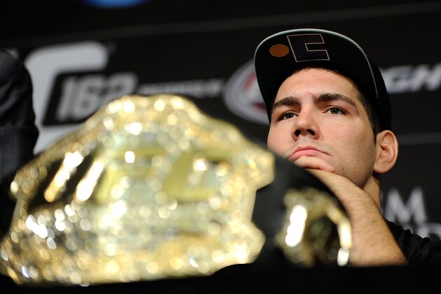 Chris Weidman looks on during the post fight news conference after his victory over Anderson Silva at a UFC 162 mixed martial arts middleweight championship bout Saturday, July 6, 2013, in Las Vegas. Weidman won with a second round TKO. (AP Photo/David Becker)