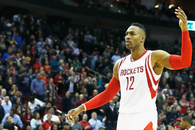 HOUSTON, TX - NOVEMBER 14:  Dwight Howard #12 of the Houston Rockets reacts to a call during a game against the Philadelphia 76ers at the Toyota Center on November 14, 2014 in Houston, Texas.  NOTE TO USER: User expressly acknowledges and agrees that, by downloading and/or using this photograph, user is consenting to the terms and conditions of the Getty Images License Agreement. (Photo by Scott Halleran/Getty Images)