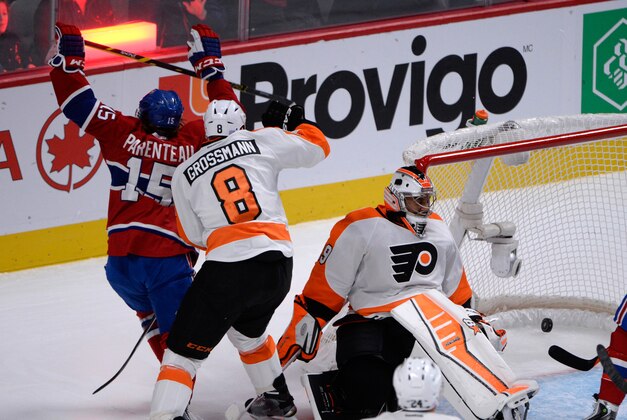 Nov 15, 2014; Montreal, Quebec, CAN; Montreal Canadiens forward Pierre-Alexandre Parenteau (15) reacts after scoring a goal against Philadelphia Flyers goalie Ray Emery (29) during the first period at the Bell Centre. Mandatory Credit: Eric Bolte-USA TODAY Sports