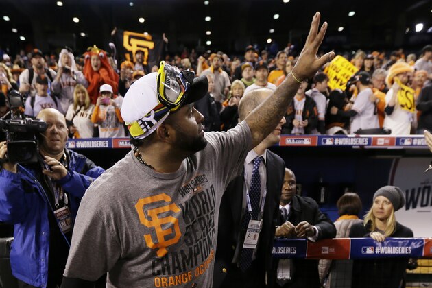 San Francisco Giants Pablo Sandoval waves to spectators after Game 7 of baseball's World Series Wednesday, Oct. 29, 2014, in Kansas City, Mo. The Giants defeated the Kansas City Royals 3-2 to win the World Series.  (AP Photo/Charlie Neibergall)