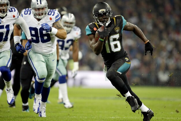 Jacksonville Jaguars running back Denard Robinson (16) runs in a touchdown against the Dallas Cowboys during the NFL football game at Wembley Stadium, London, Sunday, Nov. 9, 2014.  (AP Photo/Matt Dunham)