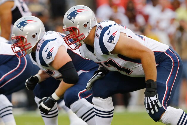 Aug 7, 2014; Landover, MD, USA; New England Patriots tackle Nate Solder (77) and Patriots offensive tackle Jordan Devey (65) line up against the Washington Redskins at FedEx Field. Mandatory Credit: Geoff Burke-USA TODAY Sports