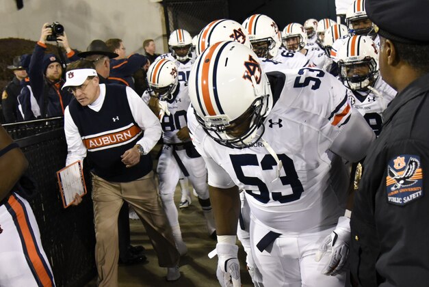 Nov 15, 2014; Athens, GA, USA; Auburn Tigers head coach Gus Malzahn runs out on to the field prior to the game against the Georgia Bulldogs at Sanford Stadium. Georgia defeated Auburn 34-7. Mandatory Credit: Dale Zanine-USA TODAY Sports
