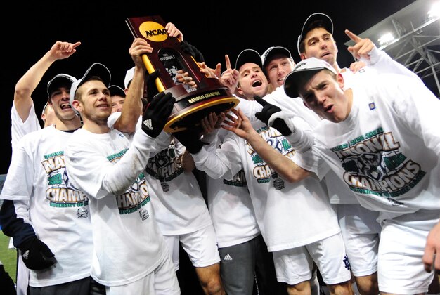 Dec 15, 2013; Chester, PA, USA; Notre Dame Fighting Irish hold up the trophy after beating the Maryland Terrapins 2-1 during the division I championship soccer game at PPL Park. Mandatory Credit: Evan Habeeb-USA TODAY Sports