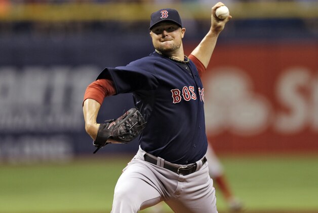 Boston Red Sox starting pitcher Jon Lester delayers to the Tampa Bay Rays during the first inning of a baseball game Friday, July 25, 2014, in St. Petersburg, Fla. (AP Photo/Chris O'Meara)
