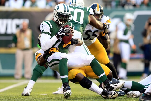 EAST RUTHERFORD, NJ - NOVEMBER 09:  Quarterback Michael Vick #1 of the New York Jets is sacked by outside linebacker Jason Worilds #93 of the Pittsburgh Steelers during a game at MetLife Stadium on November 9, 2014 in East Rutherford, New Jersey.  (Photo by Alex Trautwig/Getty Images)