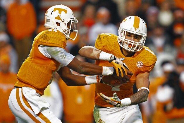 Tennessee quarterback Joshua Dobbs (11) hands the ball off to running back Jalen Hurd (1) during an NCAA college football game against Kentucky Saturday, Nov. 15, 2014 in Knoxville, Tenn. (AP Photo/Wade Payne)