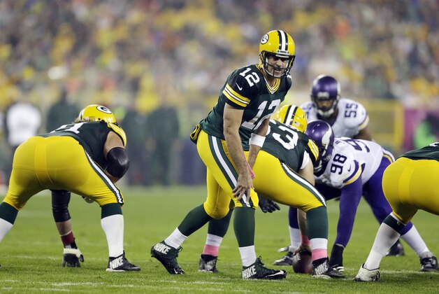 Green Bay Packers' Aaron Rodgers during the first half of an NFL football game against the Minnesota Vikings Thursday, Oct. 2, 2014, in Green Bay, Wis. (AP Photo/Tom Lynn)