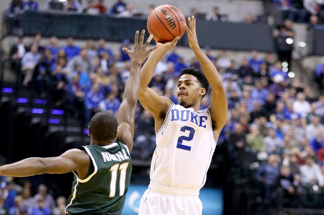 INDIANAPOLIS, IN - NOVEMBER 18: Quinn Cook #2 of the Duke Blue Devils shoots the ball during the game against the Michigan State Spartans in the State Farm Champions Classic at Bankers Life Fieldhouse on November 18, 2014 in Indianapolis, Indiana.  (Photo by Andy Lyons/Getty Images)