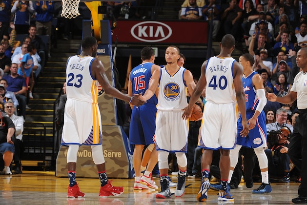 OAKLAND, CA - NOVEMBER 5: Stephen Curry #30 of the Golden State Warriors high fives teammate Draymond Green #23 during a game against the Los Angeles Clippers on November 5, 2014 at Oracle Arena in Oakland, California. NOTE TO USER: User expressly acknowledges and agrees that, by downloading and or using this photograph, user is consenting to the terms and conditions of Getty Images License Agreement. Mandatory Copyright Notice: Copyright 2014 NBAE (Photo by Noah Graham/NBAE via Getty Images)