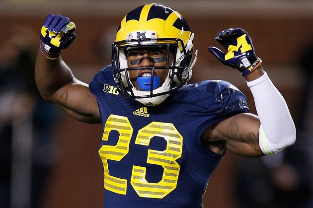 ANN ARBOR, MI - OCTOBER 11:  Dennis Norfleet #23 of the Michigan Wolverines pumps up the crowd prior to a punt return while playing the Penn State Nittany Lions on October 11, 2014 at Michigan Stadium in Ann Arbor, Michigan. Michigan won the game 18-13. (Photo by Gregory Shamus/Getty Images)