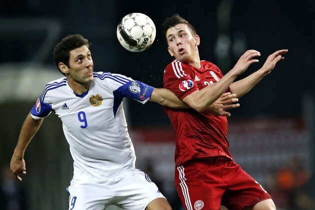 Denmark's Pierre Emile Hojbjerg, left, and Armenia's Rumyan Hovsepyan in action during the Euro qualifier soccer match, Sunday Sept. 7, 2014, in Copenhagen, Denmark. (AP Photo/Polfoto, Jens Dresling) DENMARK OUT