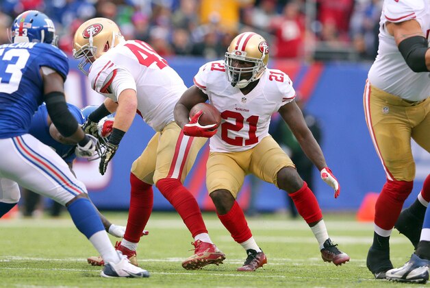 Nov 16, 2014; East Rutherford, NJ, USA; San Francisco 49ers running back Frank Gore (21) carries the ball against the New York Giants during the second quarter at MetLife Stadium. Mandatory Credit: Brad Penner-USA TODAY Sports