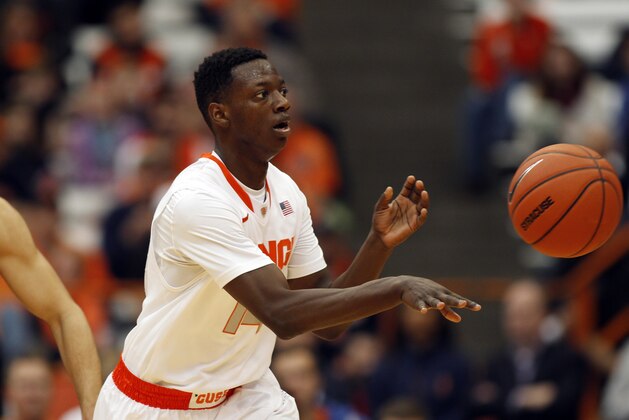 Syracuse’s Kaleb Joseph looks to pass the ball in the second half of an NCAA college basketball game against Carleton in Syracuse, N.Y., Sunday, Nov. 2, 2014. (AP Photo/Nick Lisi)
