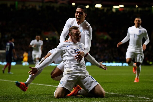 GLASGOW, SCOTLAND - NOVEMBER 18:  Wayne Rooney of England celebrates with teammate Chris Smalling of England after scoring his team's second goal during the International Friendly match between Scotland and England at Celtic Park Stadium on November 18, 2014 in Glasgow, Scotland.  (Photo by Alex Livesey/Getty Images)