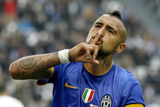 Juventus' Arturo Vidal celebrates after scoring during a Serie A soccer match between Juventus and  Palermo at the Juventus stadium, in Turin, Italy, Sunday, Oct. 26, 2014. (AP Photo/Massimo Pinca)
