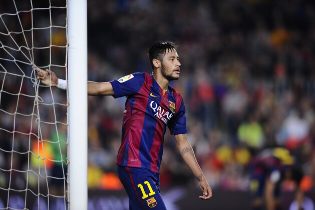 FC Barcelona's Neymar, from Brazil, reacts during a Spanish La Liga soccer match between FC Barcelona and Celta Vigo at the Camp Nou stadium in Barcelona, Spain, Saturday, Nov. 1, 2014. (AP Photo/Manu Fernandez)