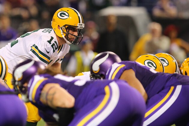 MINNEAPOLIS, MN - OCTOBER 27:  Aaron Rodgers #12 of the Green Bay Packers on the line against the Minnesota Vikings on October 27, 2013 at Mall of America Field at the Hubert Humphrey Metrodome in Minneapolis, Minnesota. (Photo by Adam Bettcher/Getty Images)
