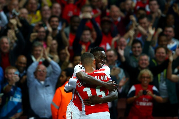 LONDON, ENGLAND - OCTOBER 01:  Danny Welbeck of Arsenal celebrates with team-mate Alex Oxlade-Chamberlain after scoring his team's fourth and his third goal during the UEFA Champions League group D match between Arsenal FC and Galatasaray AS at Emirates Stadium on October 1, 2014 in London, United Kingdom.  (Photo by Paul Gilham/Getty Images)